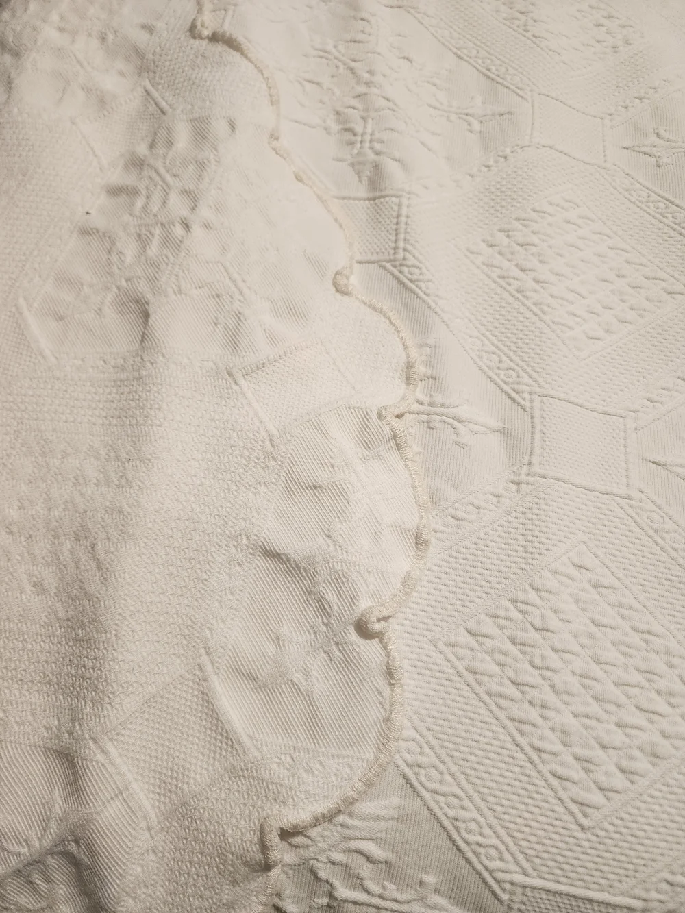 White Peacock Alley Oasis coverlet features a textured matelassé design